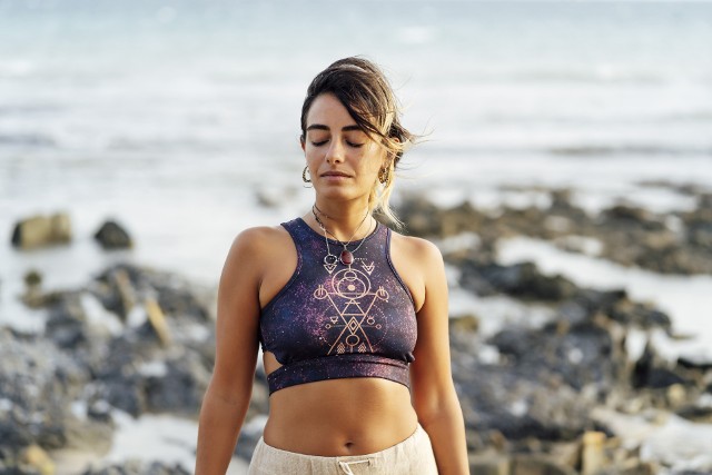 Young woman doing yoga exercises in the gym near the beach.Cadiz.Spain